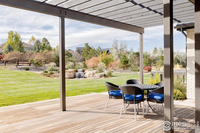 deck with a lawn and a pergola