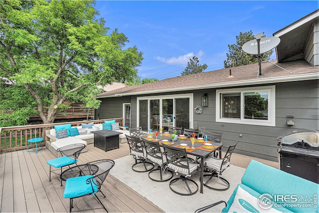 deck with an outdoor living space and outdoor dining space