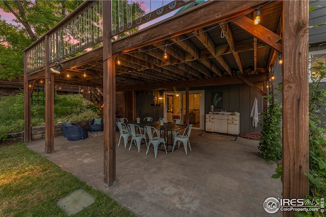 view of patio / terrace featuring a deck and outdoor dining area