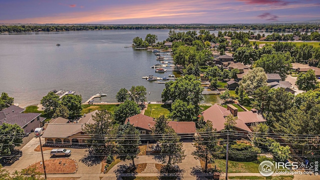 bird's eye view with a residential view and a water view