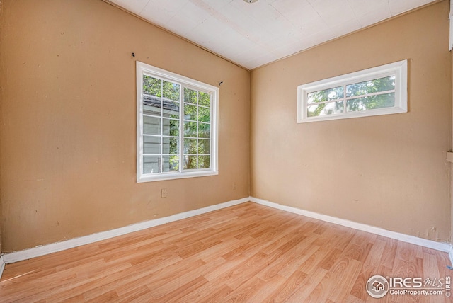 unfurnished room with light hardwood / wood-style flooring