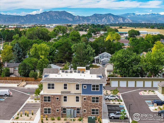 birds eye view of property featuring a mountain view