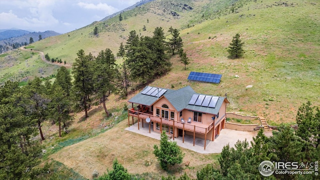 drone / aerial view with a mountain view and a rural view