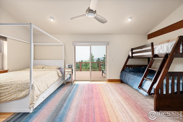 bedroom featuring hardwood / wood-style flooring, access to outside, vaulted ceiling, and ceiling fan