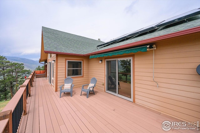 wooden terrace featuring a mountain view