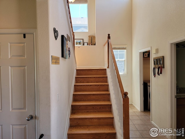 staircase featuring tile patterned flooring