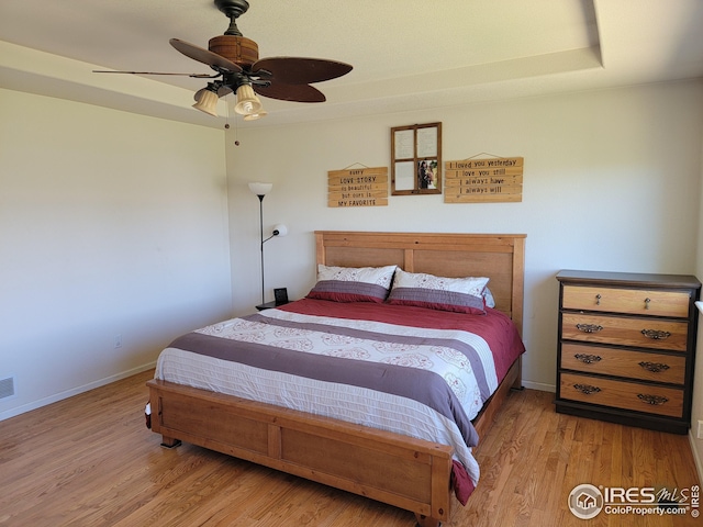 bedroom featuring ceiling fan and light hardwood / wood-style floors