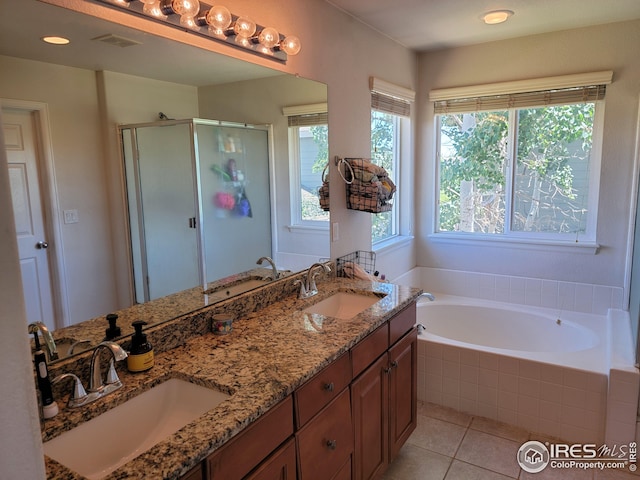 bathroom with separate shower and tub, tile patterned flooring, and vanity