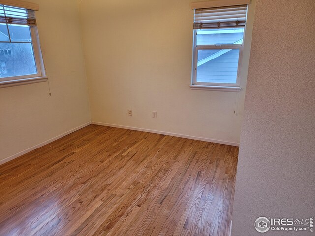 bedroom with hardwood / wood-style flooring and a closet