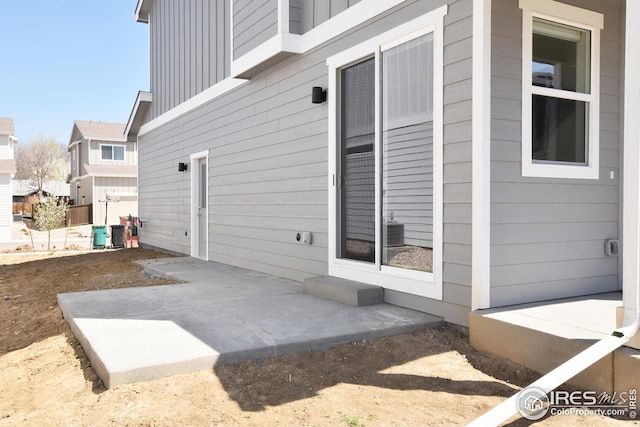 exterior space with a patio area and central AC