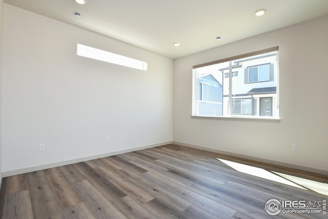 unfurnished room featuring light wood-type flooring