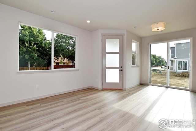 entryway with light hardwood / wood-style floors