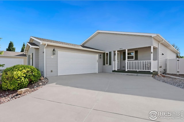 view of front of home with a garage and covered porch