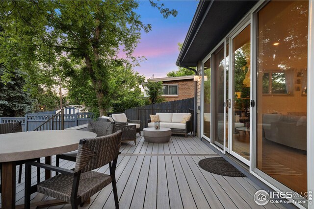 2870 18th St, Boulder, CO 80304 - deck at dusk with an outdoor living space