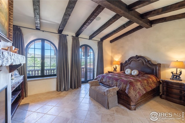 bedroom featuring lofted ceiling with beams