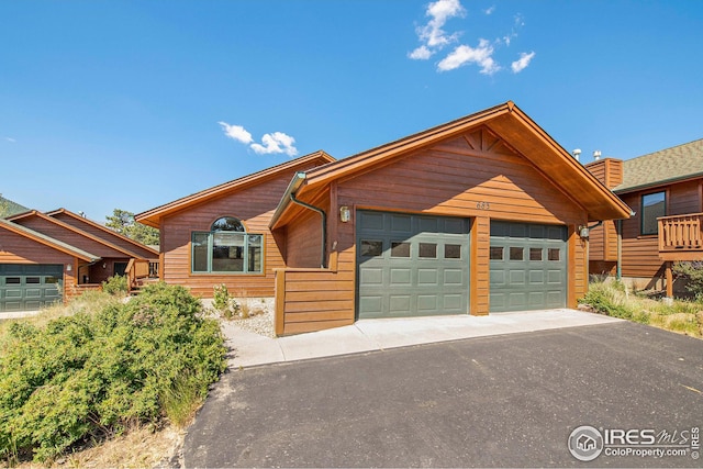 log cabin featuring a garage