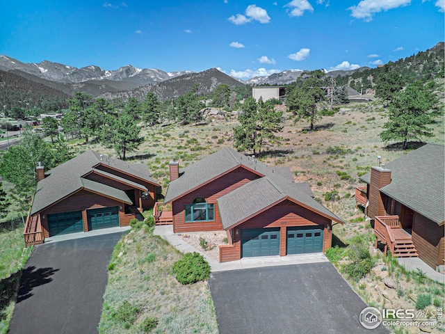 birds eye view of property featuring a mountain view