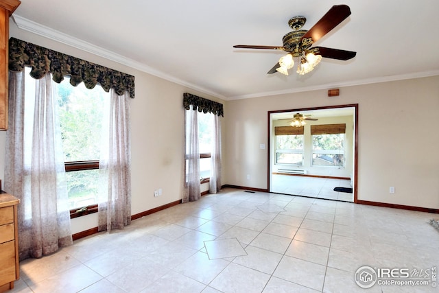 tiled spare room featuring crown molding