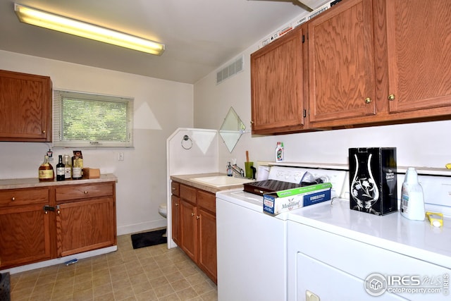 laundry room featuring sink and washing machine and dryer