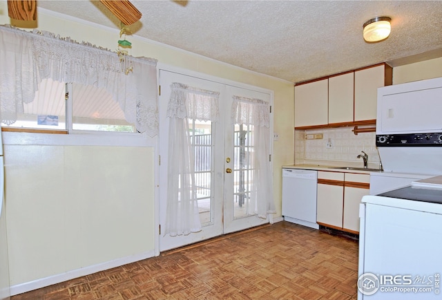 kitchen featuring white cabinetry, sink, french doors, and dishwasher