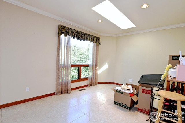 misc room with crown molding, a skylight, and light tile patterned flooring