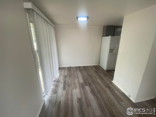 hallway with dark wood-type flooring