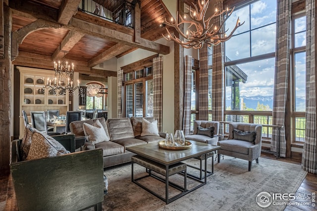 300 Samaia Ct, Tabernash, CO 80478 - living area with an inviting chandelier, wood ceiling, arched walkways, and beam ceiling