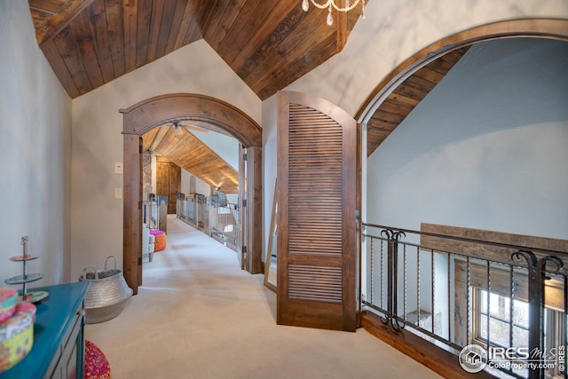 300 Samaia Ct, Tabernash, CO 80478 - hallway featuring arched walkways, carpet floors, lofted ceiling, and wood ceiling