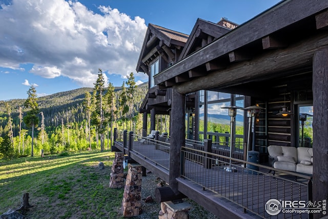 300 Samaia Ct, Tabernash, CO 80478 - view of home's exterior featuring a forest view, a mountain view, and a lawn
