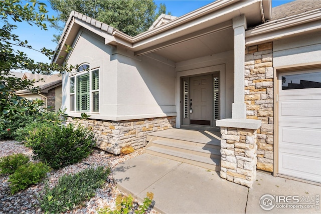 entrance to property featuring a garage