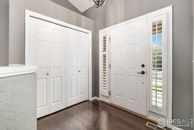 entrance foyer featuring dark hardwood / wood-style floors