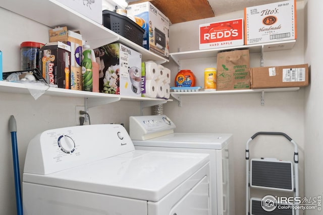 clothes washing area featuring washer and dryer