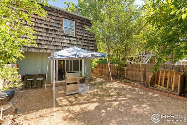 view of yard featuring cooling unit and a patio area