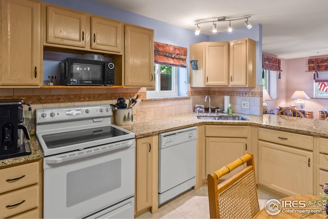 kitchen featuring decorative backsplash, light brown cabinets, white appliances, sink, and light tile patterned flooring