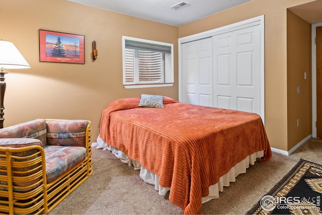 bedroom featuring a closet and carpet