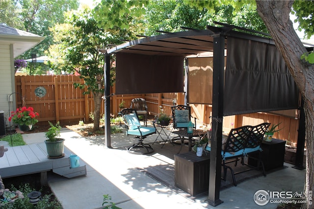 view of patio featuring a deck and a pergola