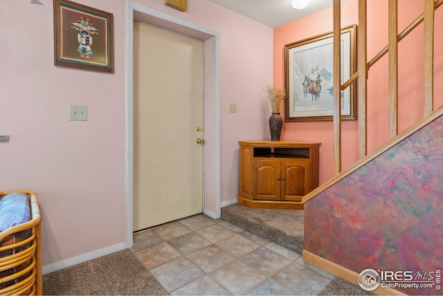 view of tiled foyer entrance