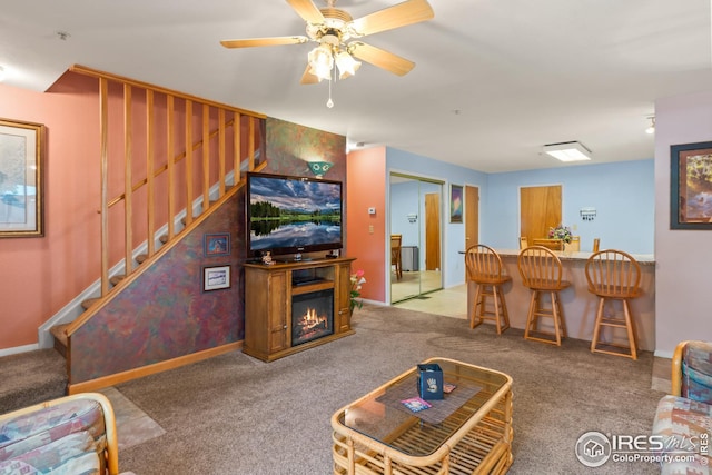 living room featuring ceiling fan and light colored carpet