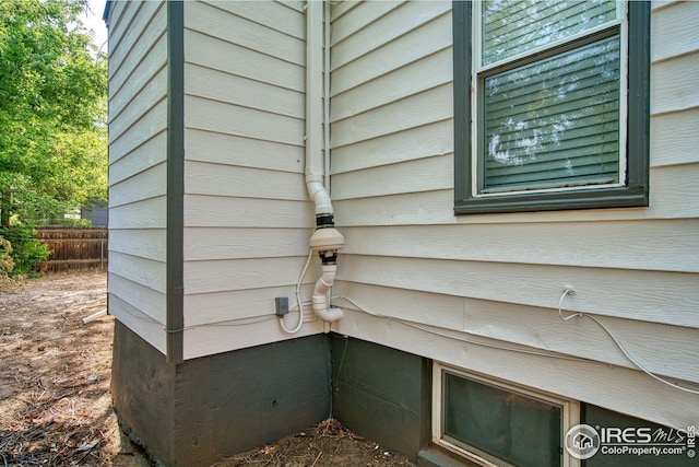 exterior details featuring fence