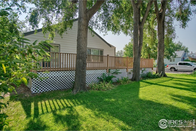 view of yard with a wooden deck