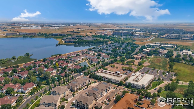 bird's eye view featuring a water view and a residential view