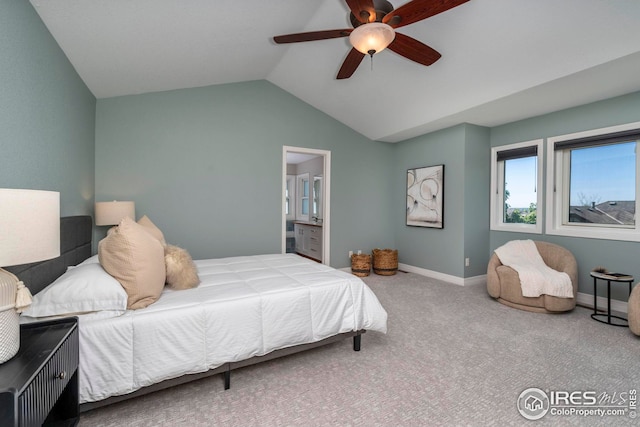 carpeted bedroom featuring ceiling fan, lofted ceiling, and connected bathroom