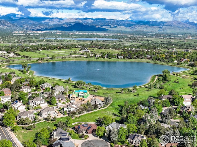 bird's eye view with a water and mountain view