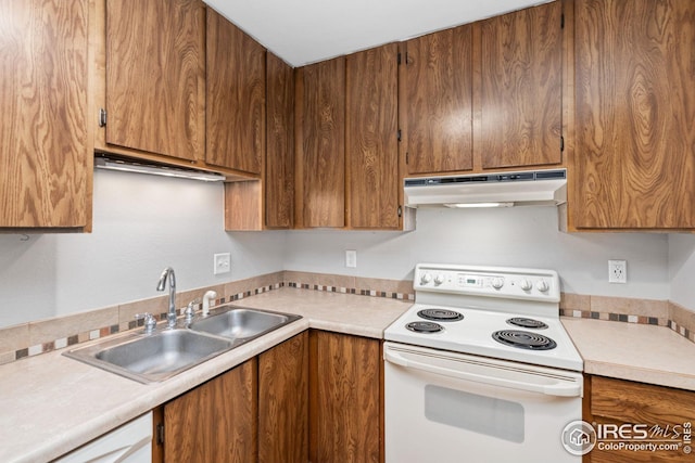 kitchen featuring sink and white appliances