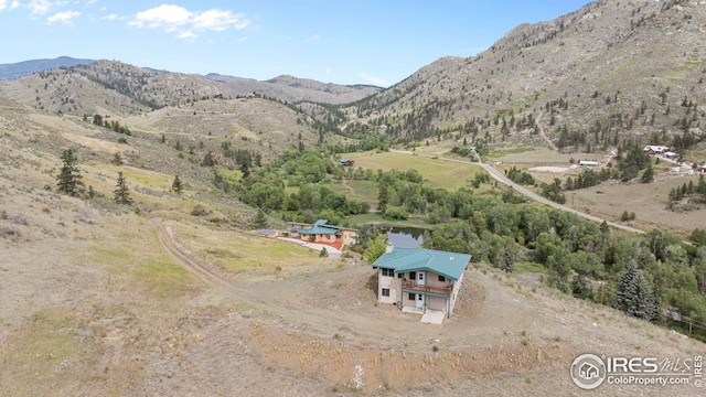 birds eye view of property featuring a mountain view