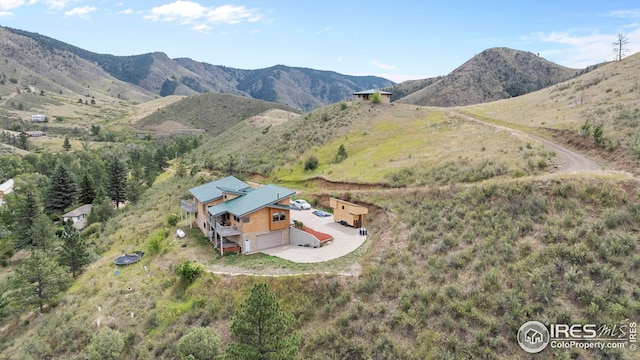 birds eye view of property with a mountain view