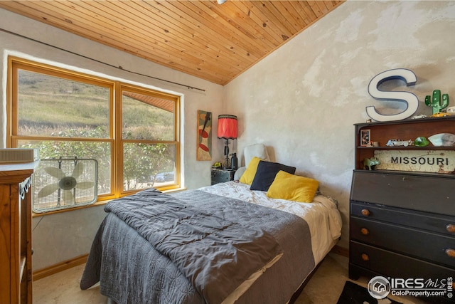 bedroom with lofted ceiling, wood ceiling, and baseboards