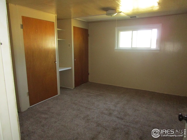 carpeted empty room with ceiling fan