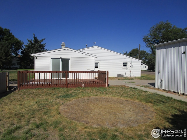 view of outbuilding with a lawn