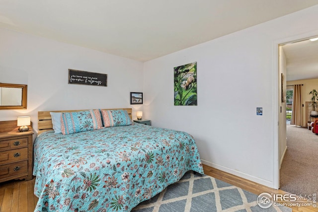 bedroom featuring wood-type flooring